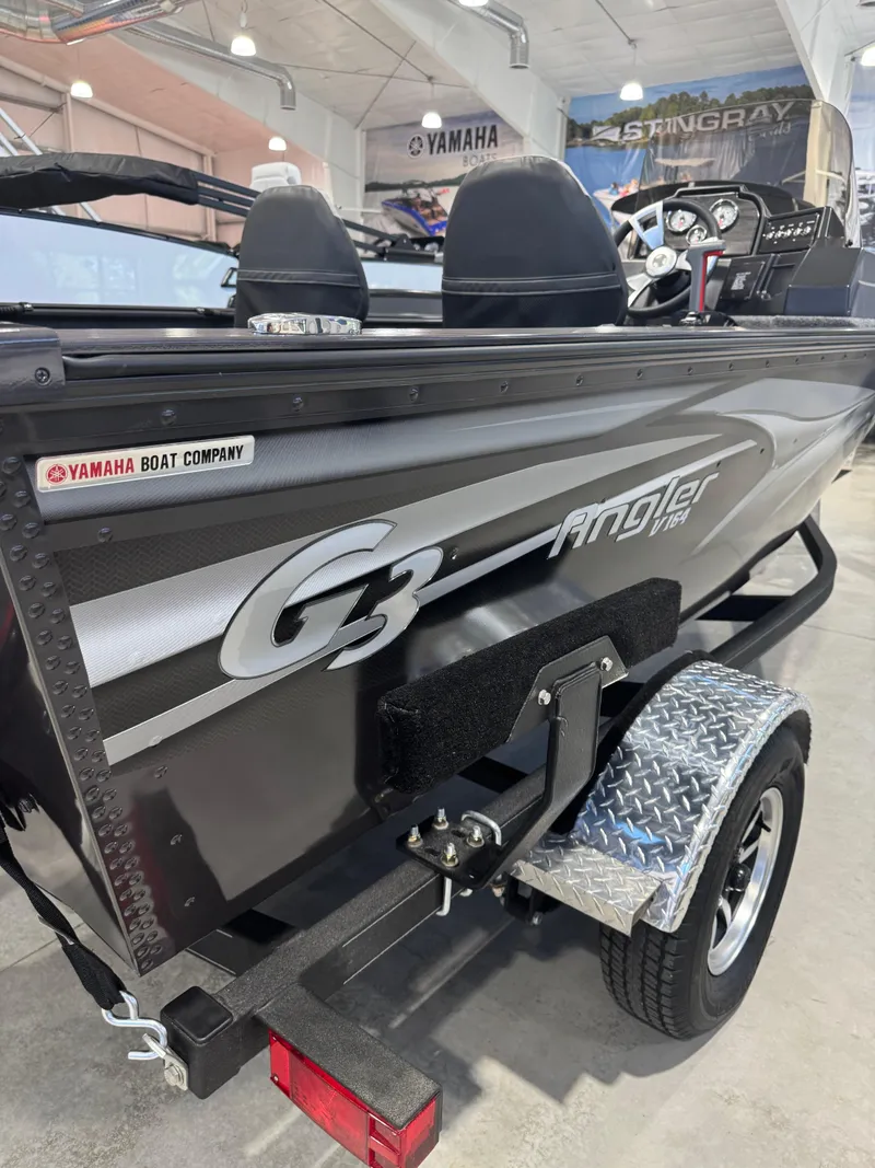 Slide: The Image of 2025 G3 Angler boat by Yamaha, displayed in showroom with trailer. - 3