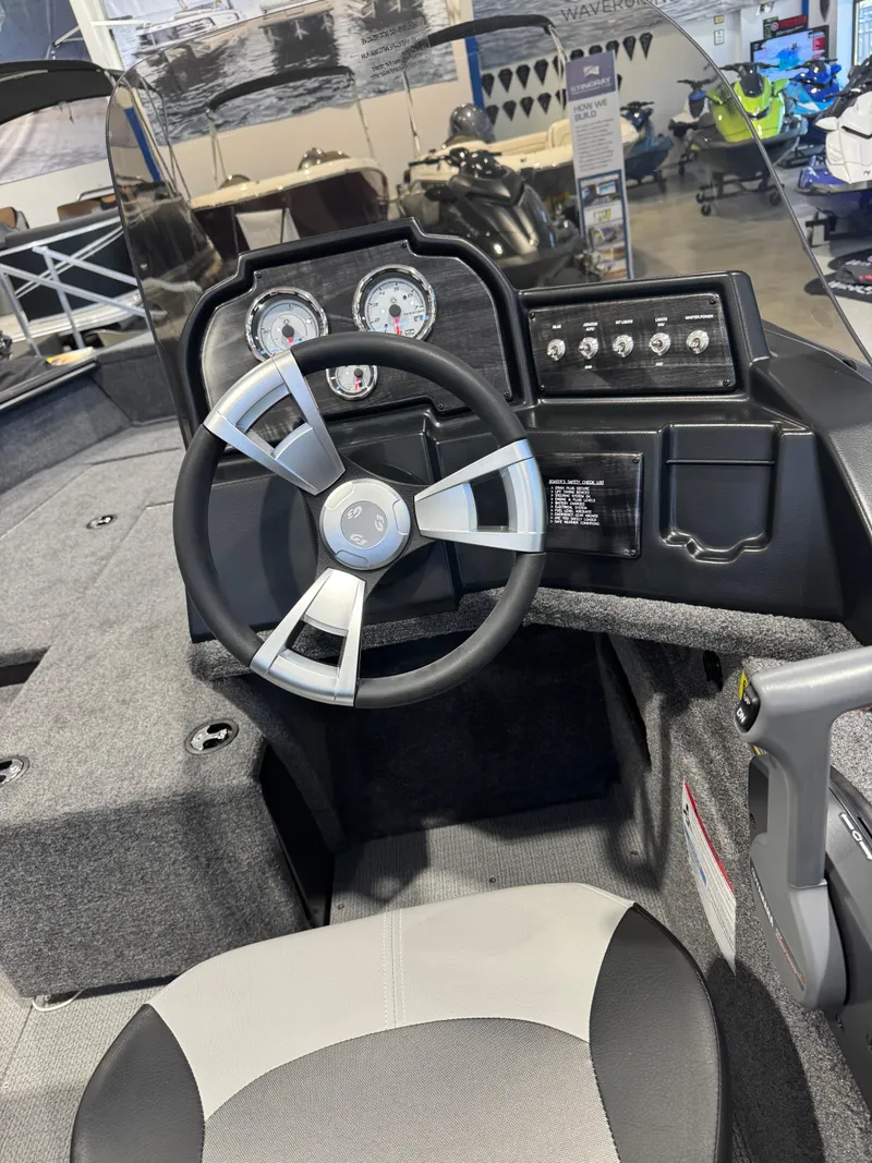 Slide: The Image of 2025 G3 AV-164C Carpet boat dashboard with steering wheel and gauges. - 6