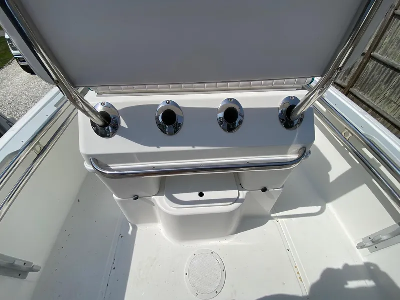 Slide: The Image of 1995 Edgewater Dougherty 1800 CC Marlin boat interior with rod holders and storage. - 10