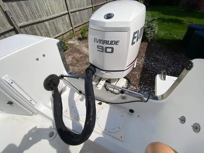 Slide: The Image of 1995 Edgewater Dougherty 1800 CC Marlin boat with Evinrude 90 outboard motor. - 11