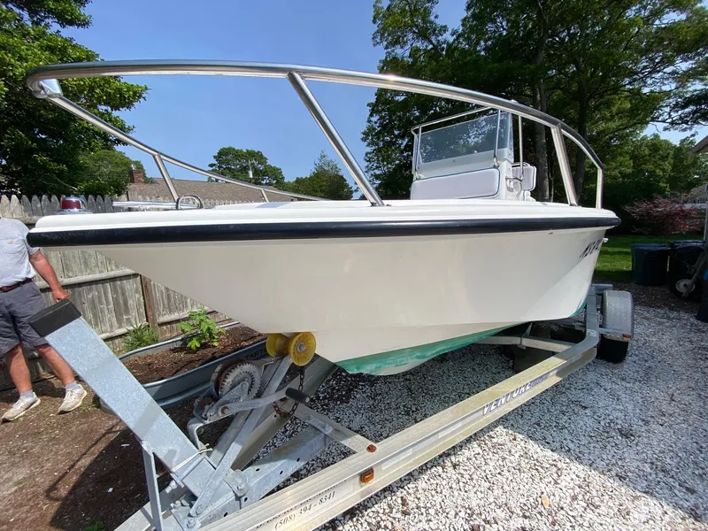 Slide: The Image of 1995 Edgewater Dougherty 1800 CC Marlin boat on trailer, parked outdoors. - 3