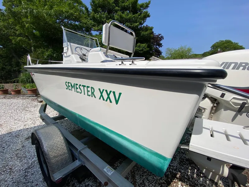 Slide: The Image of 1995 Edgewater Dougherty 1800 CC Marlin boat on trailer, labeled "Semester XXV". - 4