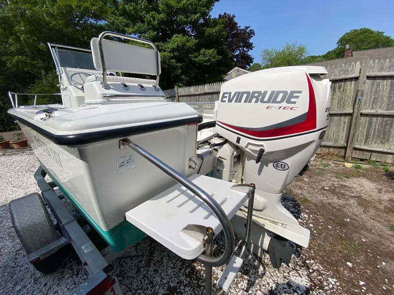 Slide: The Image of 1995 Edgewater Dougherty 1800 CC Marlin boat with Evinrude E-TEC engine on trailer. - 5