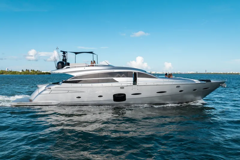 The Image of Luxury 2012 Pershing 92 yacht cruising on open water under clear blue skies. - 0