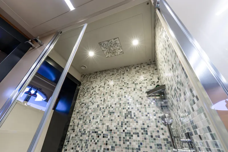 Slide: The Image of Luxurious bathroom with mosaic tiles in a 2012 Pershing 92 yacht. - 12