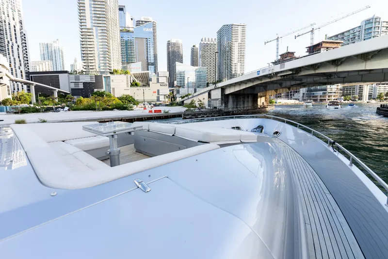 Slide: The Image of Luxurious 2012 Pershing 92 yacht cruising near urban skyline and bridge. - 26