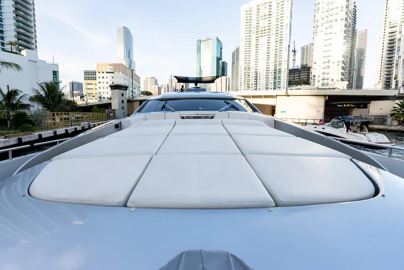 Slide: The Image of Luxury Pershing 92 yacht from 2012 docked in an urban marina setting. - 28