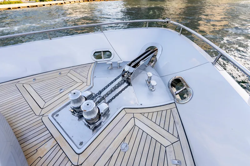 Slide: The Image of Bow deck of 2012 Pershing 92 yacht with anchor chains and winches. - 29