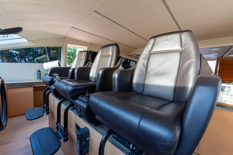 Slide: The Image of Luxurious leather seating in a 2012 Pershing 92 yacht interior. - 31