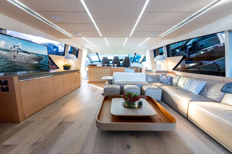 Slide: The Image of Luxurious interior of a 2012 Pershing 92 yacht with modern furnishings and large windows. - 39