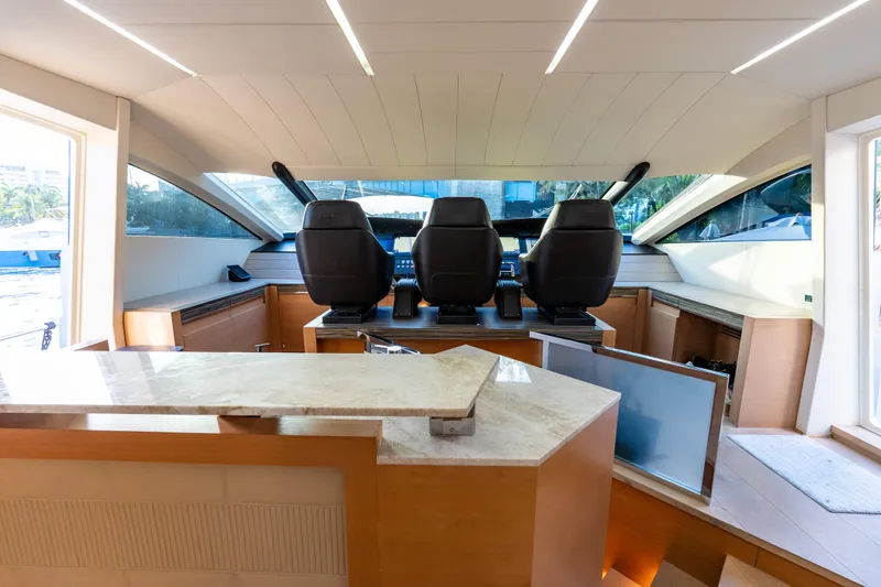 Slide: The Image of Luxurious interior of a 2012 Pershing 92 yacht with modern helm and seating. - 41