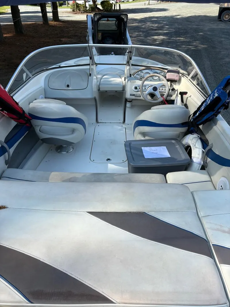 Slide: The Image of 2006 Maxum 1800 SR3 boat interior with seating and steering wheel. - 9