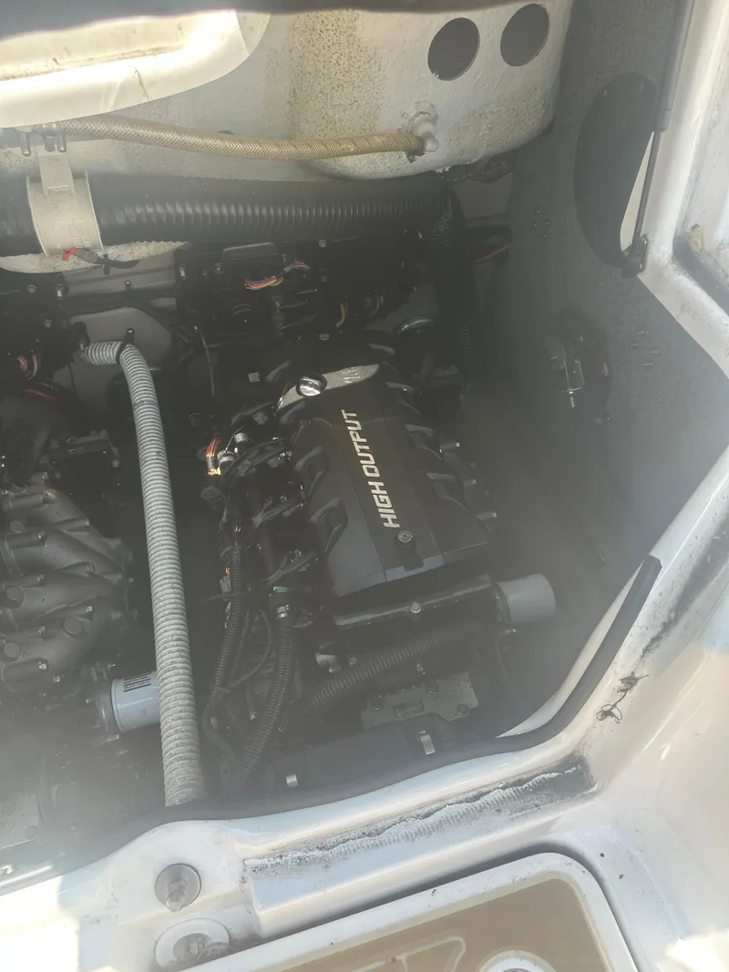 Slide: The Image of Engine compartment of a 2013 Yamaha Boats 242 Limited S, featuring a high output engine. - 11