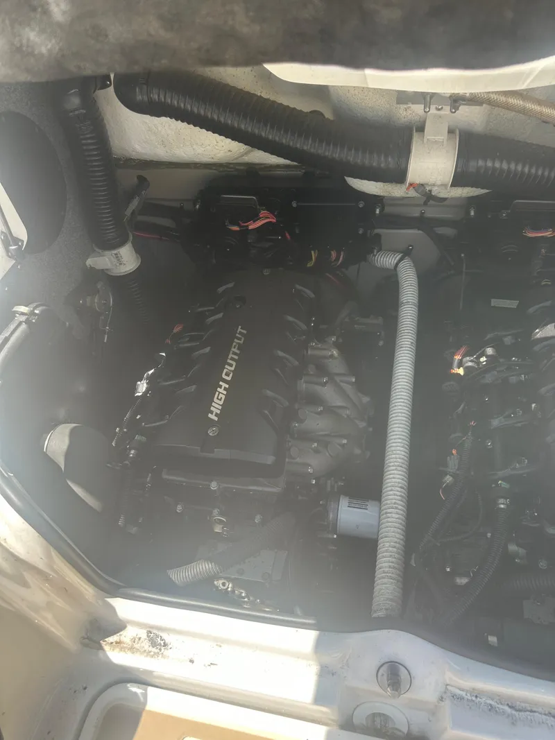 Slide: The Image of Engine compartment of a 2013 Yamaha Boats 242 Limited S, featuring a high-output engine. - 12