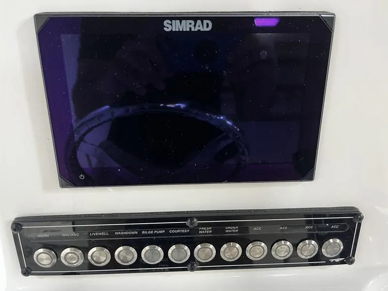 Slide: The Image of Simrad display and control panel on 2025 Tidewater 1910 Bay Max boat. - 10