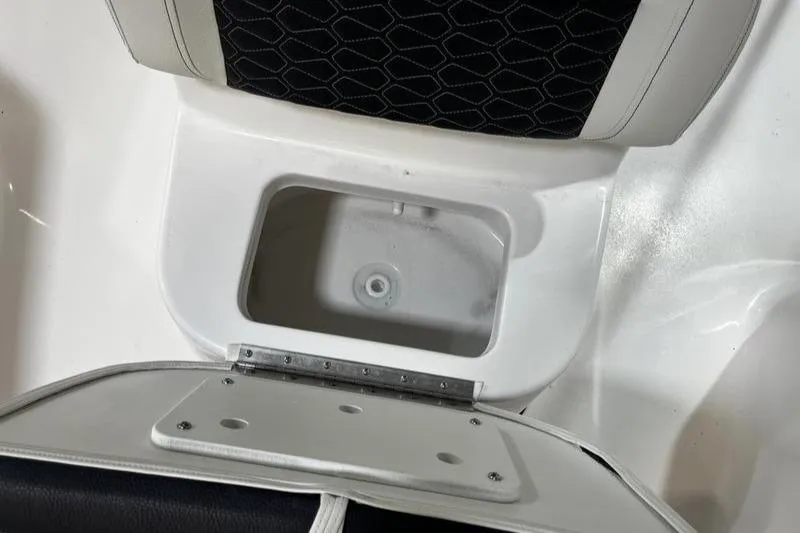 Slide: The Image of 2025 Tidewater 1910 Bay Max boat seat with storage compartment open. - 16