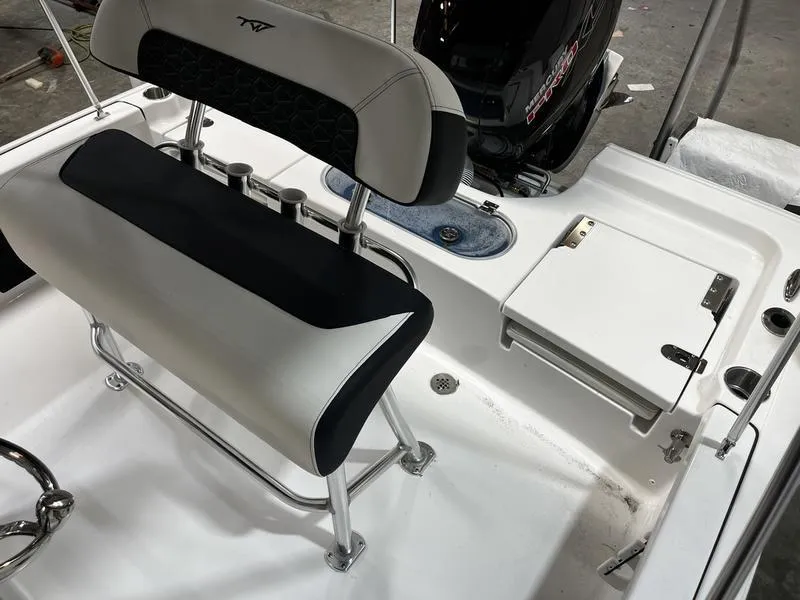Slide: The Image of 2025 Tidewater 1910 Bay Max boat interior with seating and storage compartments. - 4