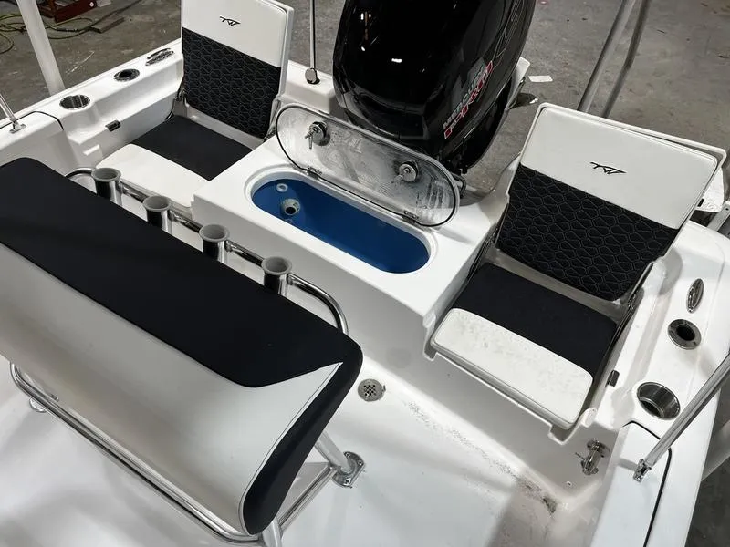 Slide: The Image of 2025 Tidewater 1910 Bay Max boat interior with seating and storage compartments. - 5