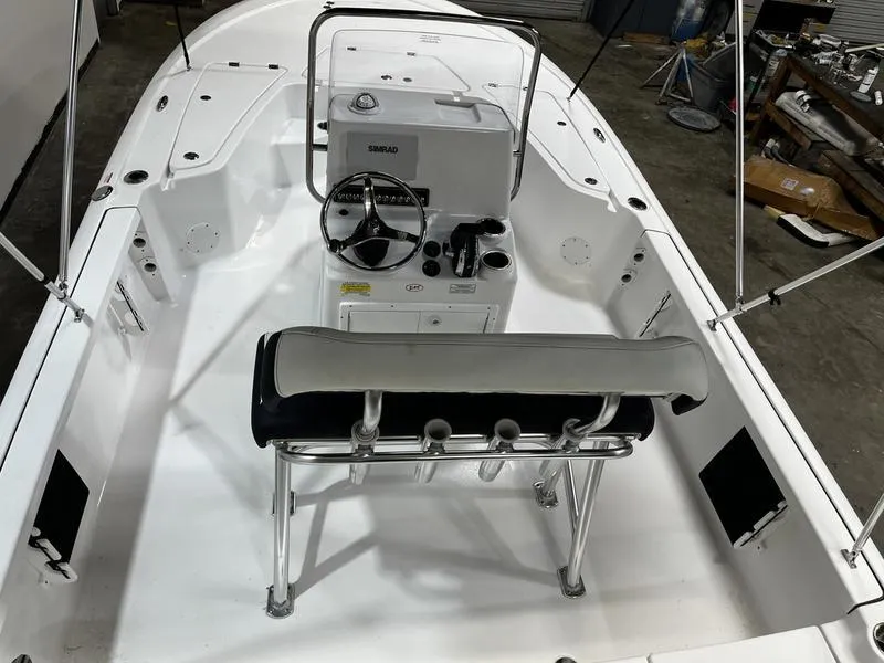 Slide: The Image of 2025 Tidewater 1910 Bay Max boat interior with steering console and seating. - 8