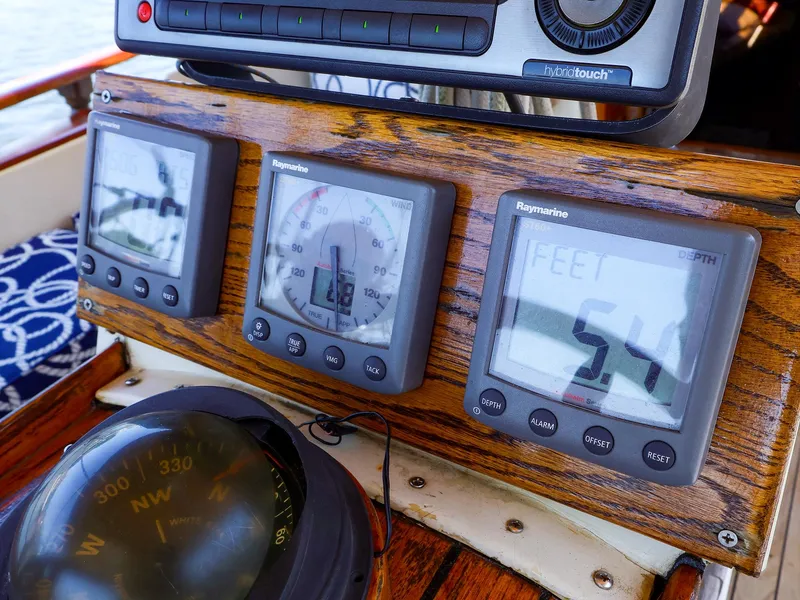 Slide: The Image of Instrumentation panel on a 1987 Gozzard 36 sailboat, featuring Raymarine displays. - 10