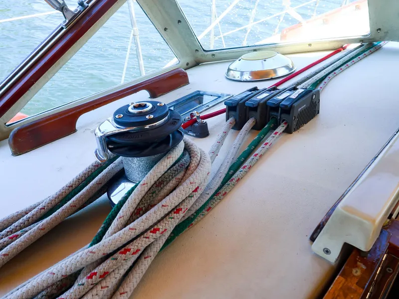 Slide: The Image of Sailboat deck with winch and ropes on a 1987 Gozzard 36. - 20