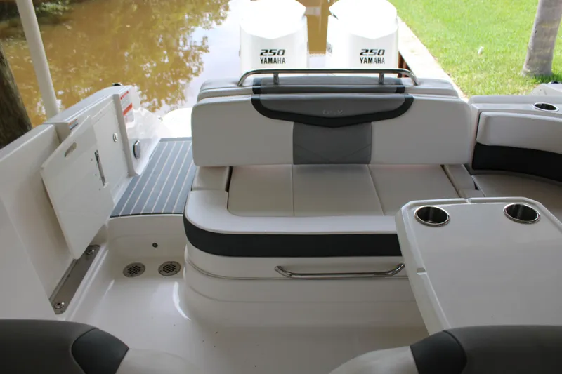 Slide: The Image of 2021 Chaparral 280 OSX boat interior with seating and cup holders. - 10