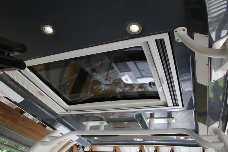 Slide: The Image of 2021 Chaparral 280 OSX boat interior with skylight and LED lighting. - 18