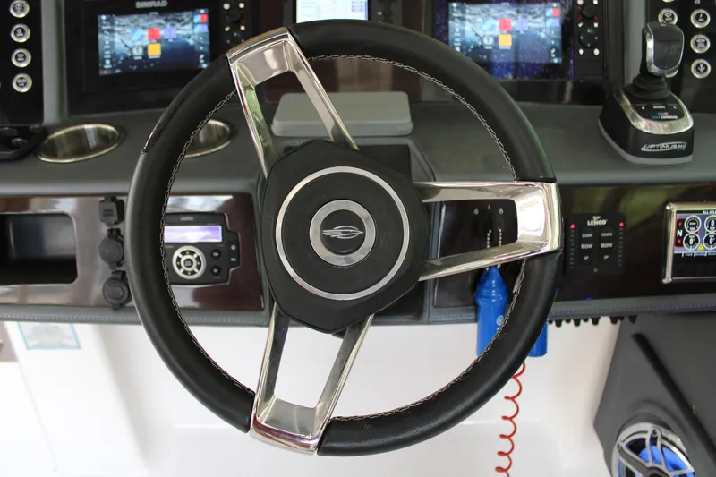 Slide: The Image of Steering wheel and dashboard of 2021 Chaparral 280 OSX boat. - 20