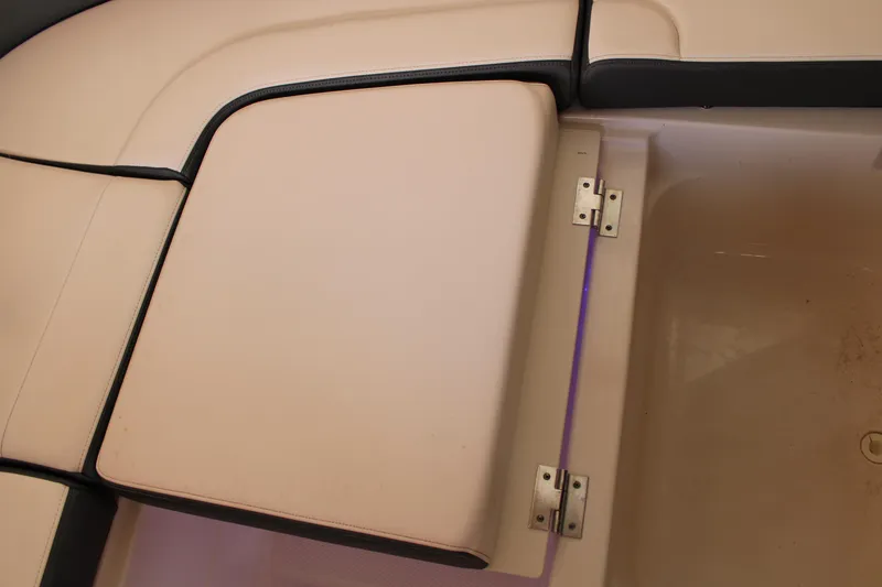 Slide: The Image of 2021 Chaparral 280 OSX boat seat with storage compartment and beige upholstery. - 23