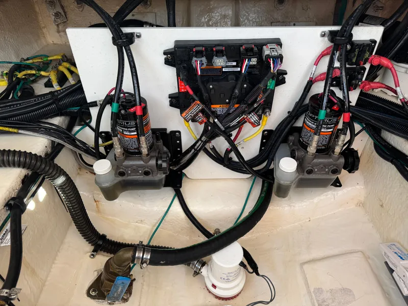 Slide: The Image of Engine compartment of 2021 Chaparral 280 OSX with wiring and hydraulic systems. - 39