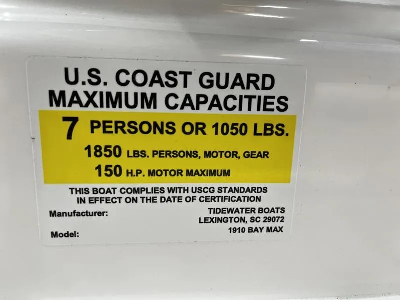 Slide: The Image of U.S. Coast Guard capacity label for 2025 Tidewater 1910 Bay Max boat, 7 persons or 1050 lbs. - 14