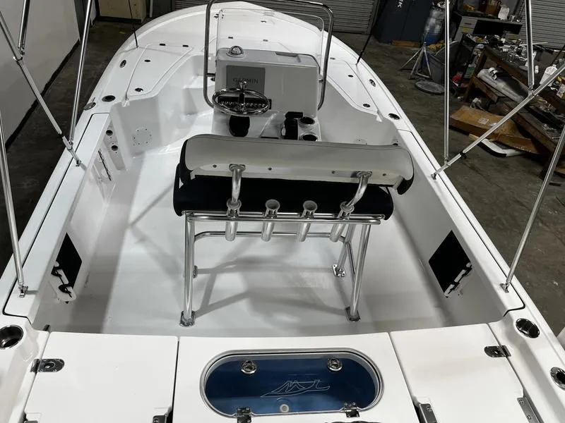 Slide: The Image of 2025 Tidewater 1910 Bay Max boat interior with seating and steering console. - 4