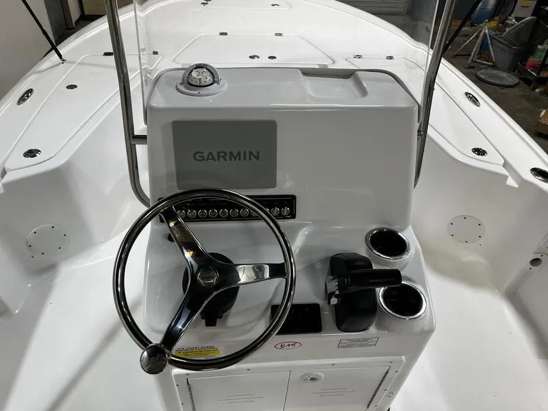 Slide: The Image of 2025 Tidewater 1910 Bay Max boat console with Garmin navigation system and steering wheel. - 7