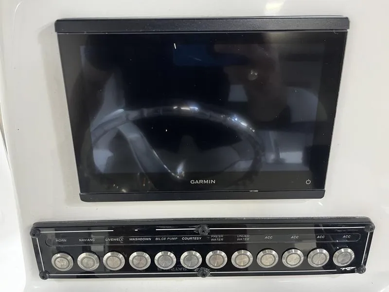 Slide: The Image of Garmin display and control panel on 2025 Tidewater 1910 Bay Max boat. - 8