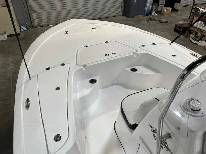 Slide: The Image of 2025 Tidewater 1910 Bay Max boat interior with seating and storage compartments. - 11