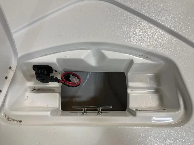 Slide: The Image of 2025 Tidewater 1910 Bay Max boat compartment with wiring and cleat. - 13