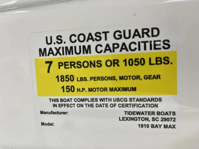 Slide: The Image of U.S. Coast Guard capacity label for Tidewater 1910 Bay Max, 2025 model, 7 persons or 1050 lbs. - 14