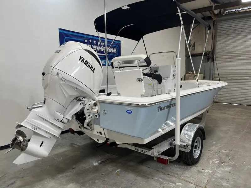 Slide: The Image of 2025 Tidewater 1910 Bay Max boat with Yamaha engine on trailer in garage. - 3