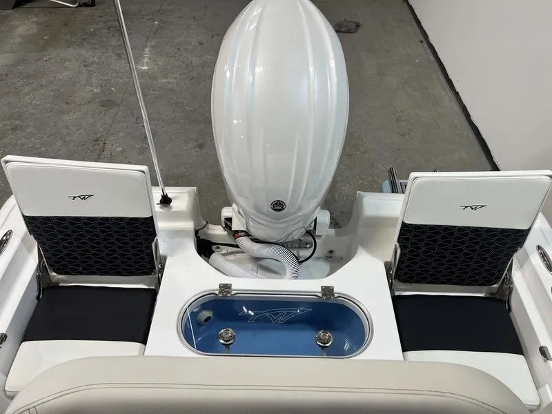 Slide: The Image of 2025 Tidewater 1910 Bay Max boat interior with motor and seating. - 5