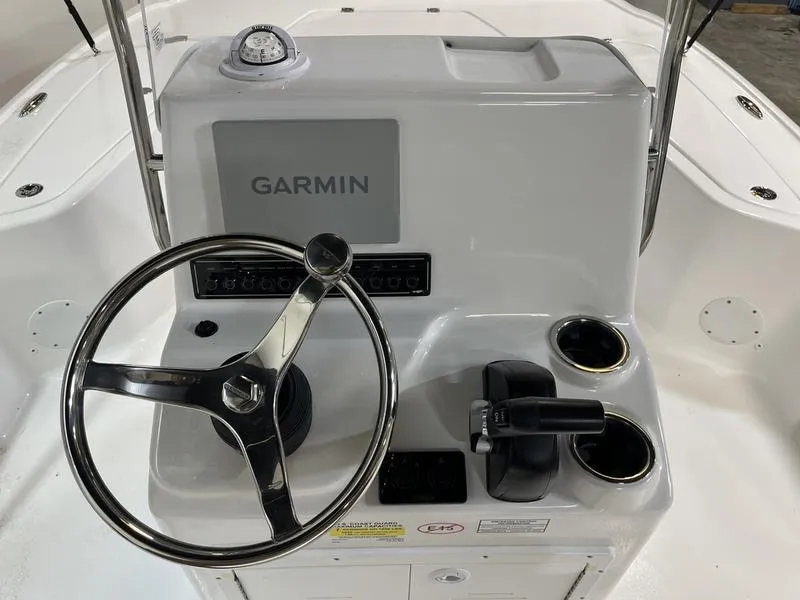 Slide: The Image of Tidewater 1910 Bay Max 2025 boat console with Garmin display and steering wheel. - 6