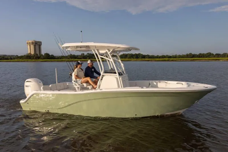 Slide: The Image of Manufacturer Provided Image: 2025 Sea Fox 228 Commander boat cruising on a calm river. - 2