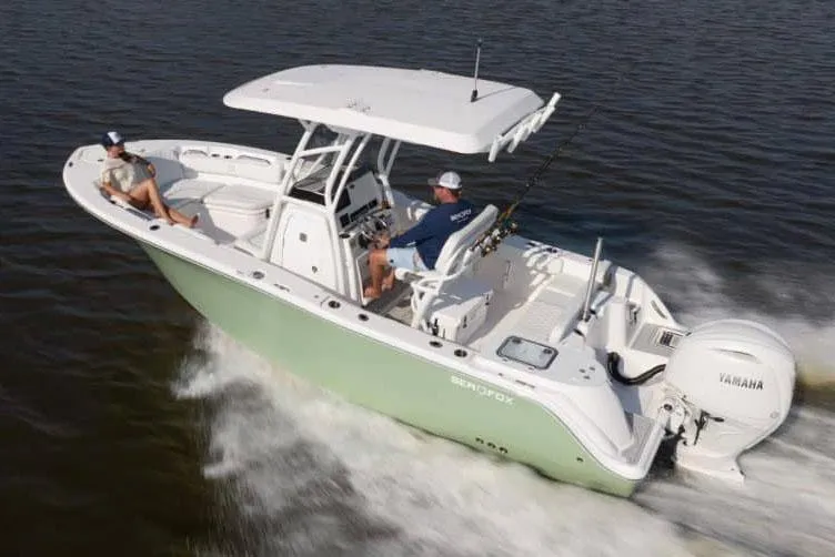 Slide: The Image of Manufacturer Provided Image: 2025 Sea Fox 228 Commander boat cruising on water with two passengers. - 4