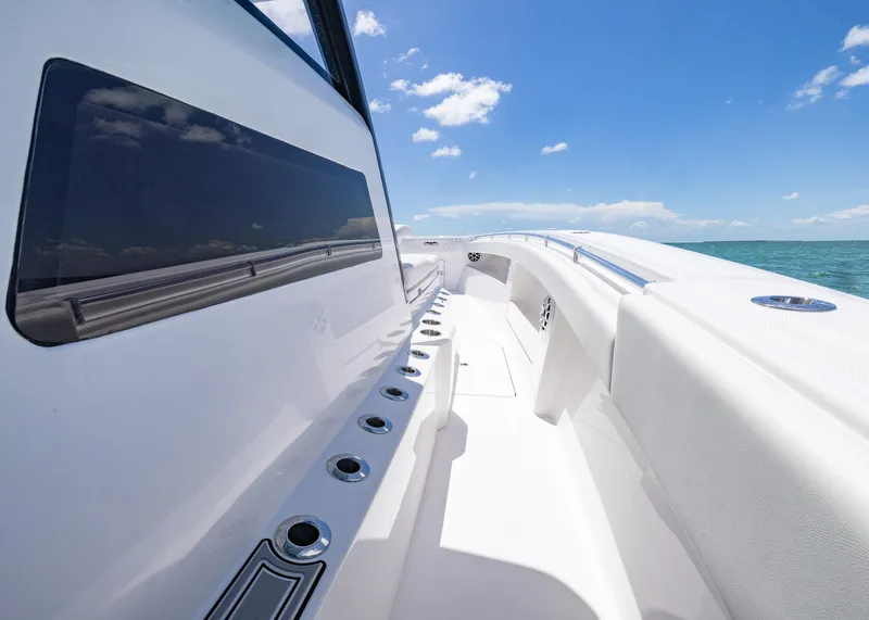 Slide: The Image of 2025 Invincible 43 Open Fisherman boat on open sea under clear blue sky. - 12