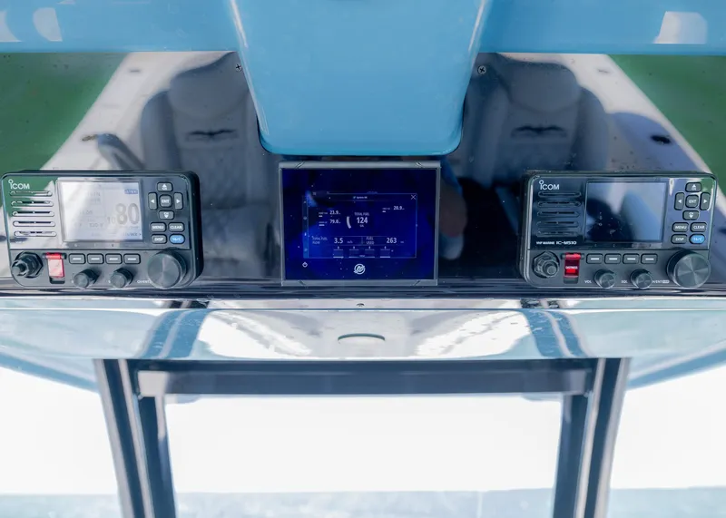 Slide: The Image of Control panel of 2025 Invincible 43 Open Fisherman with navigation and communication systems. - 18