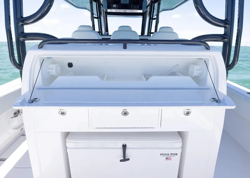 Slide: The Image of 2025 Invincible 43 Open Fisherman boat interior with storage and seating. - 21