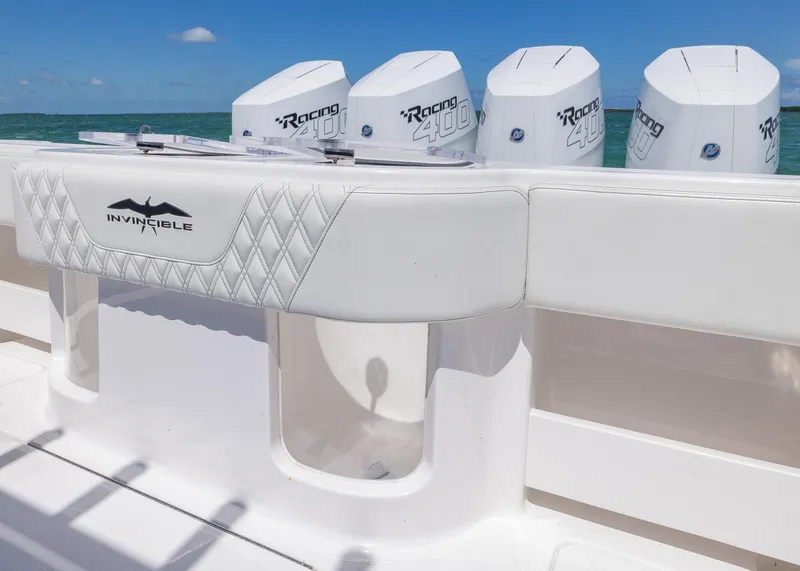 Slide: The Image of 2025 Invincible 43 Open Fisherman boat with quad Racing 400 engines, white upholstery. - 24