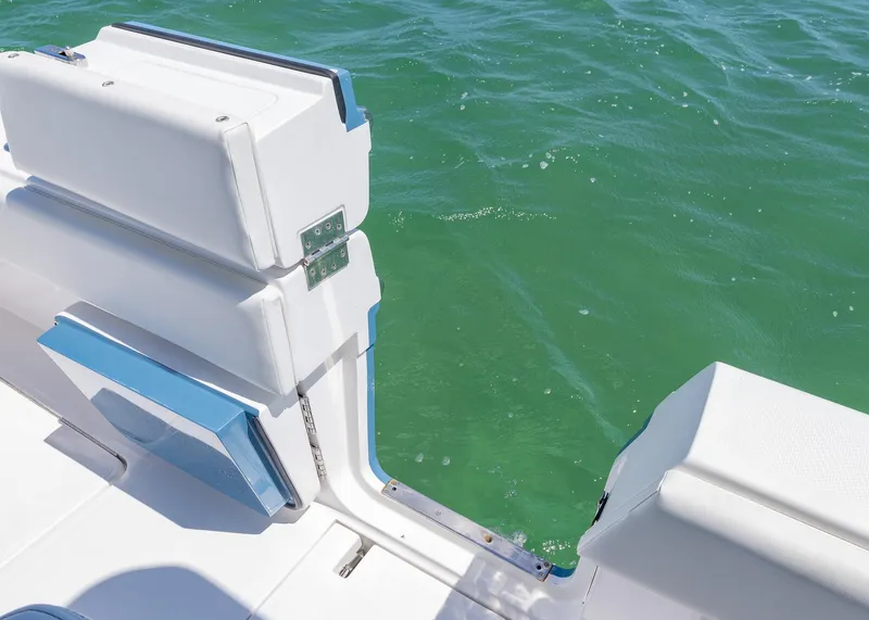 Slide: The Image of 2025 Invincible 43 Open Fisherman boat with open side door on turquoise water. - 26