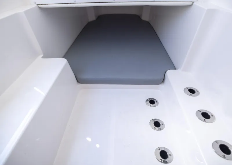 Slide: The Image of Interior view of 2025 Invincible 43 Open Fisherman boat, featuring seating and drainage system. - 28