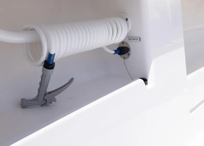 Slide: The Image of Coiled hose and nozzle on 2025 Invincible 43 Open Fisherman boat. - 34