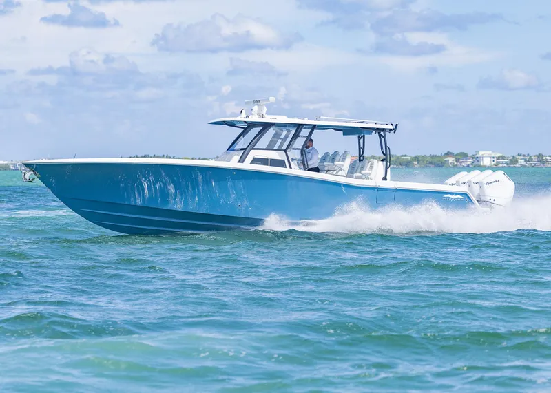 Slide: The Image of 2025 Invincible 43 Open Fisherman cruising on blue ocean waters. - 4